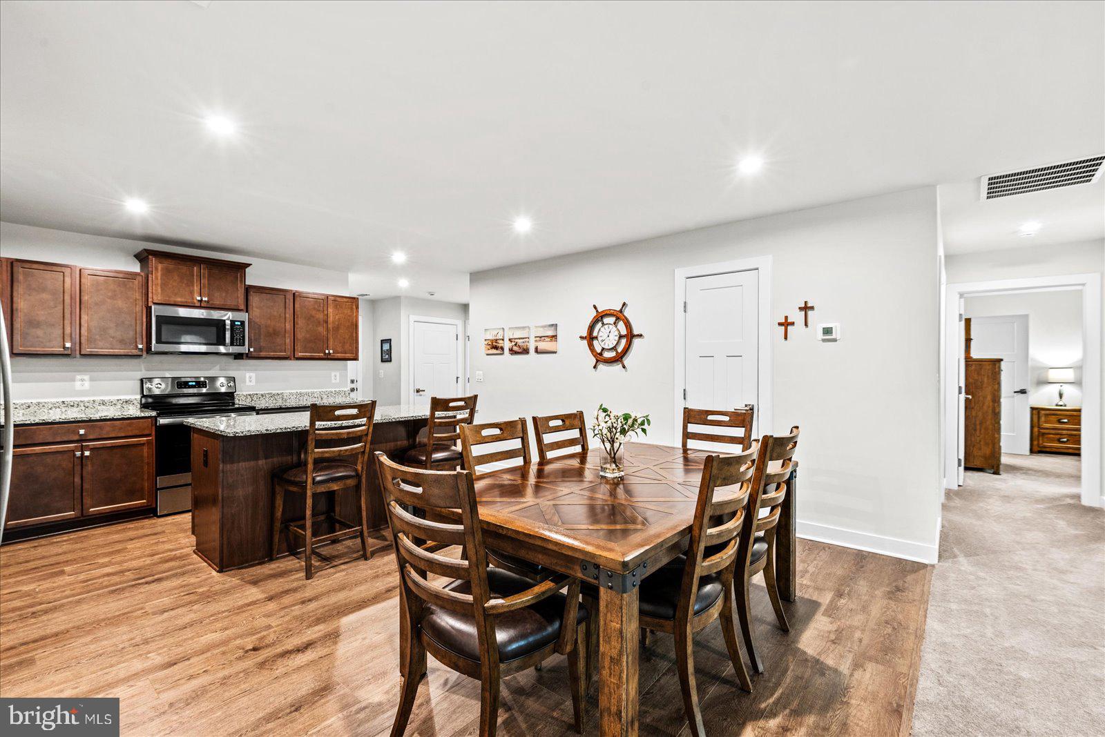 35150 Daisy Way Locust Grove, VA 22508 - Photo 11 of 34 Dining looking toward primary suite and laundry
