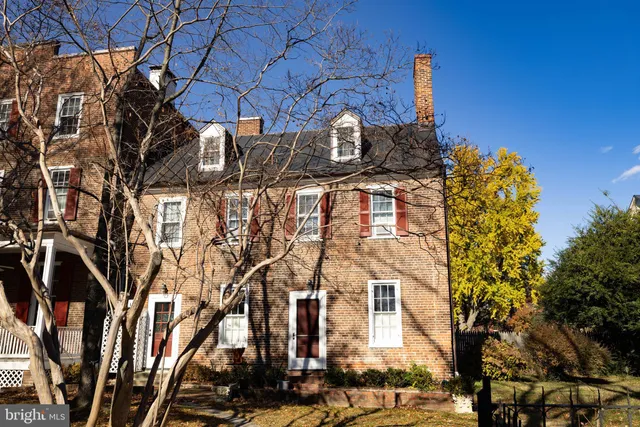 a view of a building with a yard