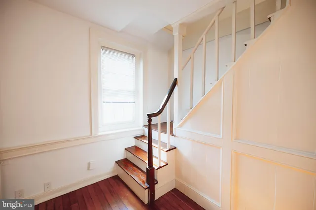 a view of entryway with wooden floor