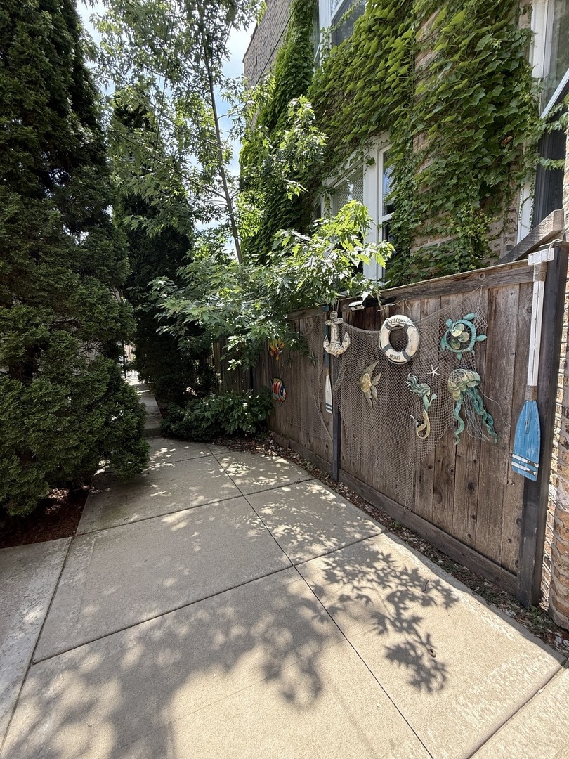 3721 West Belden Avenue, Unit 1 Chicago, IL 60647 - Photo 7 of 23 a backyard of a house with lots of green space