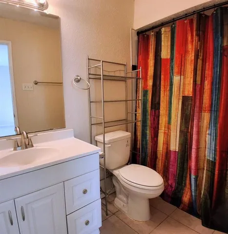 an empty room with a fan