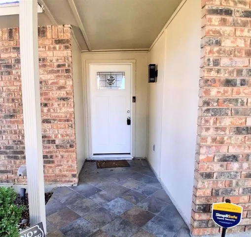 a view of a room with furniture and wooden floor