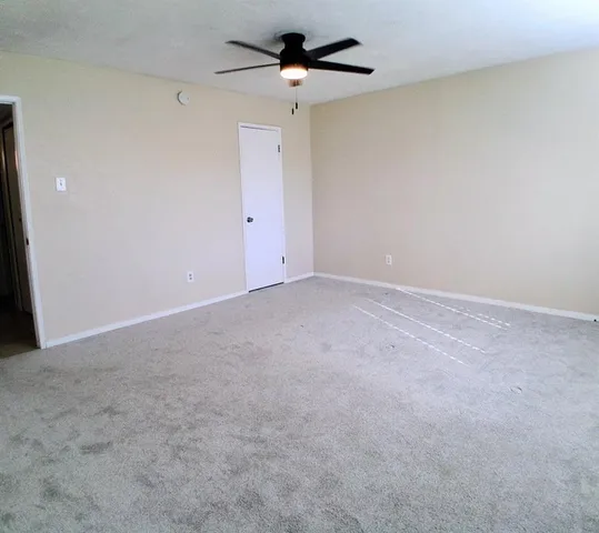 a bathroom with a toilet a sink and a mirror
