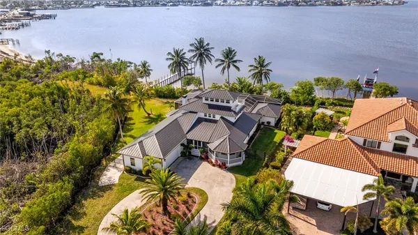 an aerial view of a house with a yard