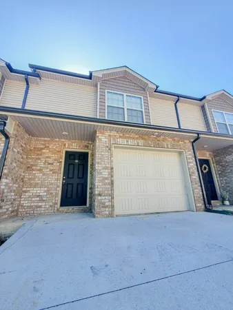 a front view of a house with a garage