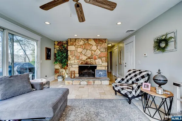 a living room with furniture and a fireplace
