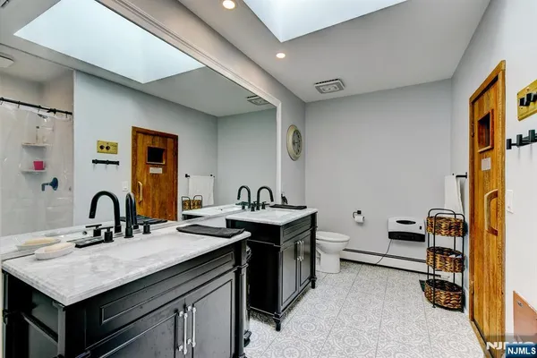 a kitchen with a sink a stove and a refrigerator