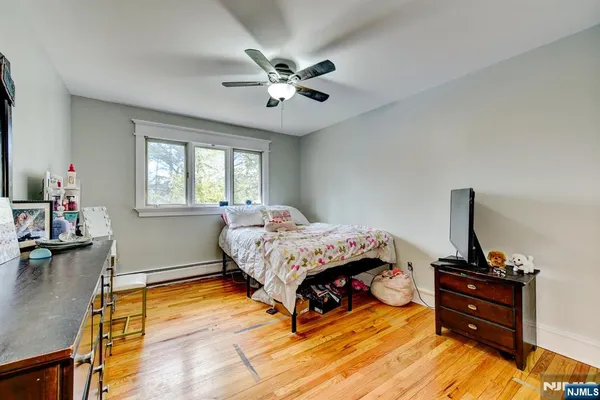 a bedroom with furniture and a window