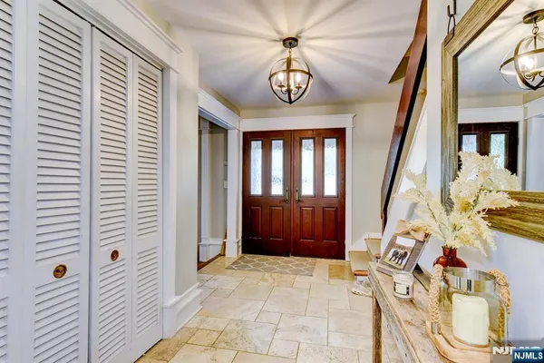 a view of an entryway with a chandelier