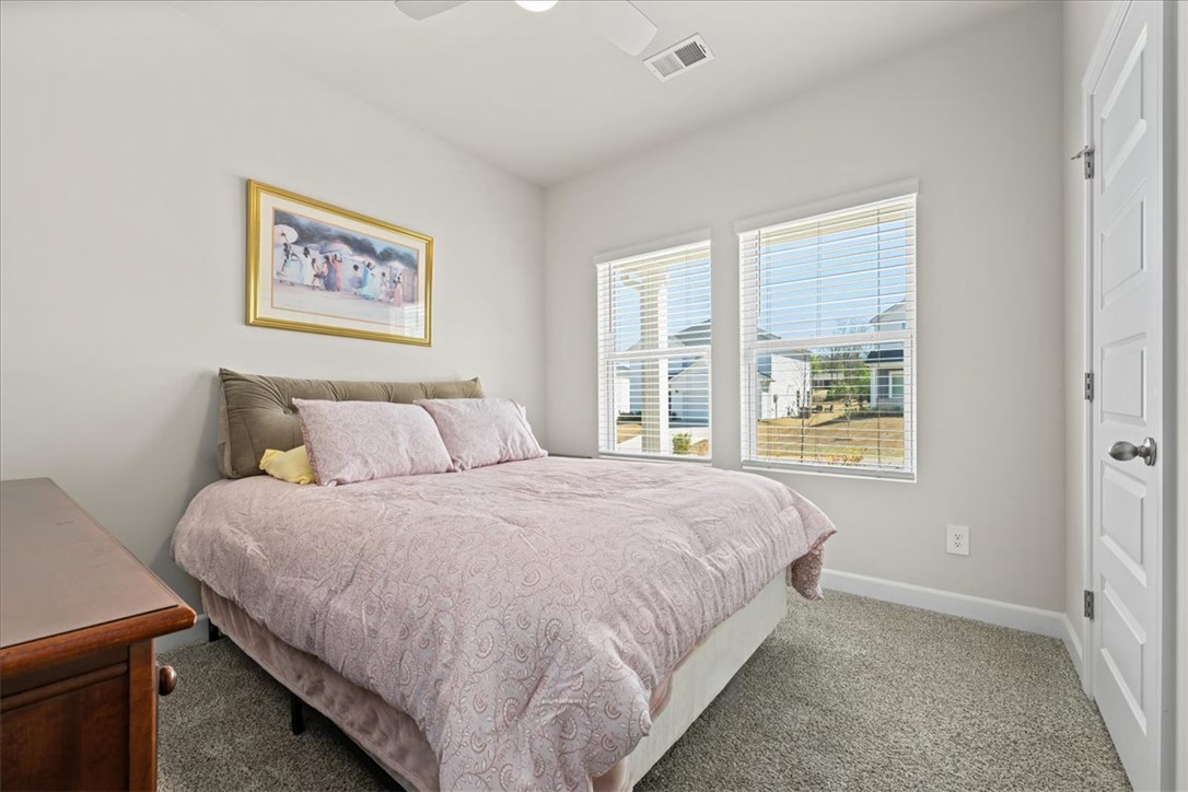 106 Purcell Way Easley, SC 29642 - Photo 28 of 39 This cozy bedroom offers a tranquil retreat with ample natural light.