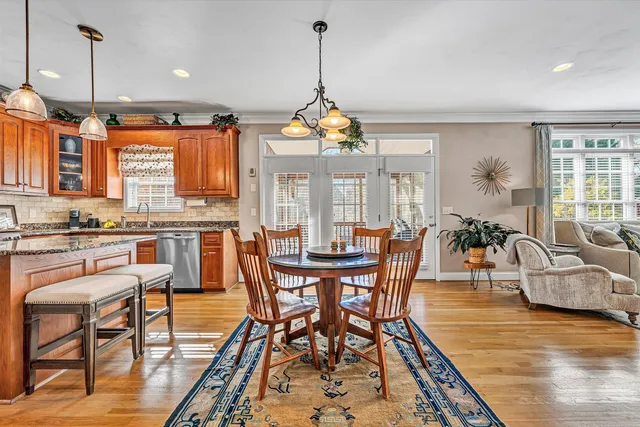 a living room with a fireplace and a flat screen tv