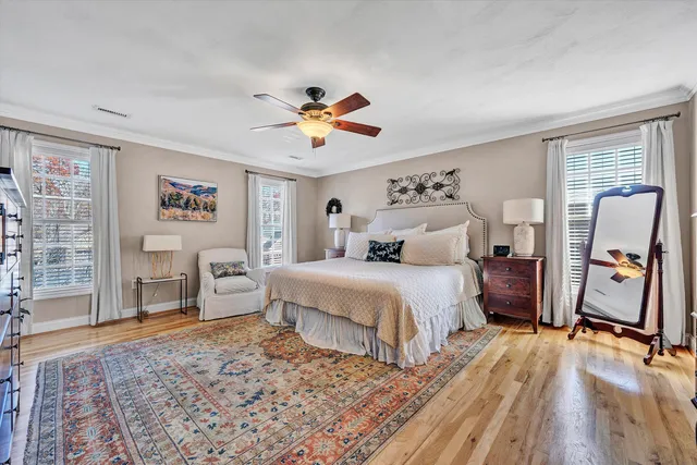 a bathroom with double sink toilet and a mirror