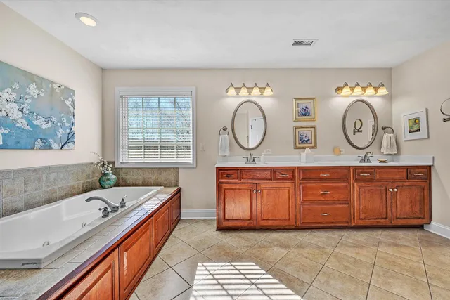 a view of a hallway with wooden floor and stairs