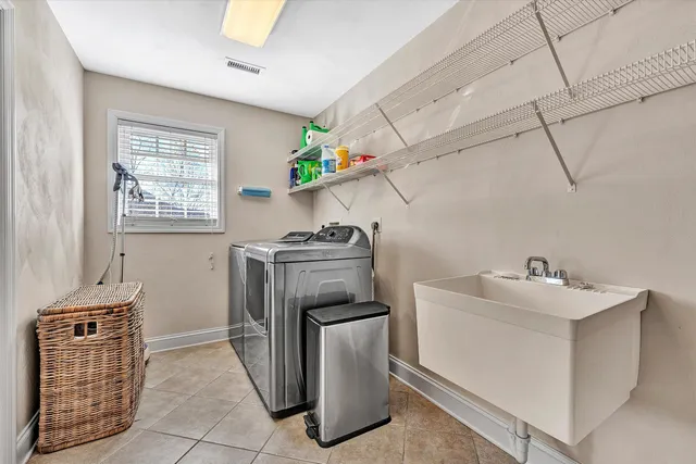 a kitchen with cabinets appliances and a window