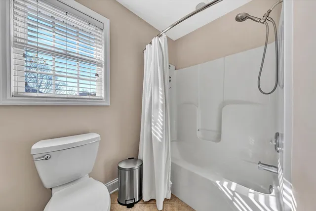 a couple of table chair in front of a house