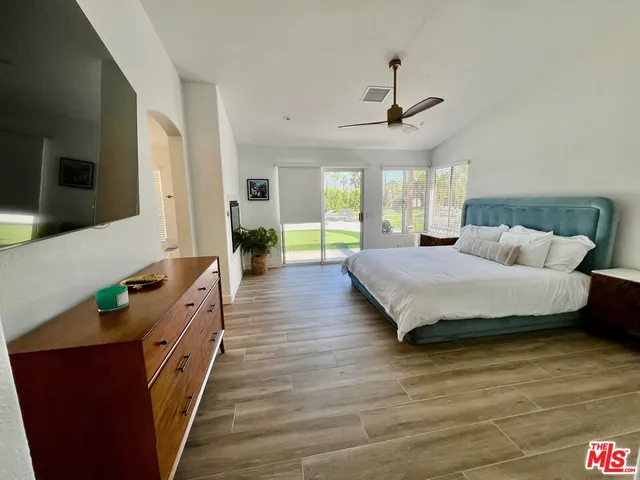 a view of a swimming pool with a yard