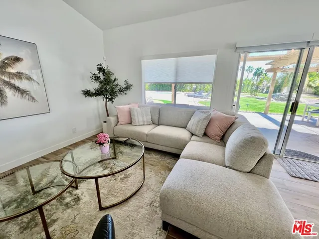 a view of a house with swimming pool and a yard