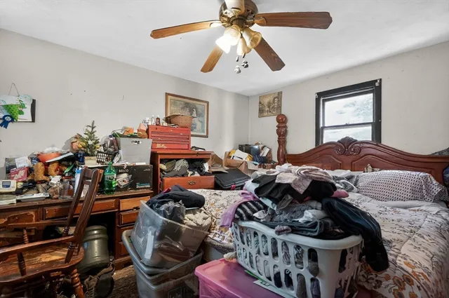 a bedroom with furniture a bed and a window