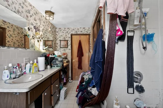 a kitchen with a sink and a refrigerator