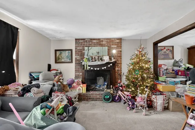 a living room with lots of furniture and a fireplace