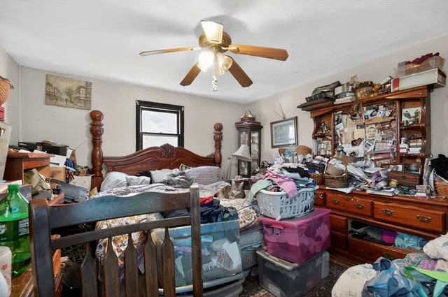 a bedroom with furniture and wooden floor
