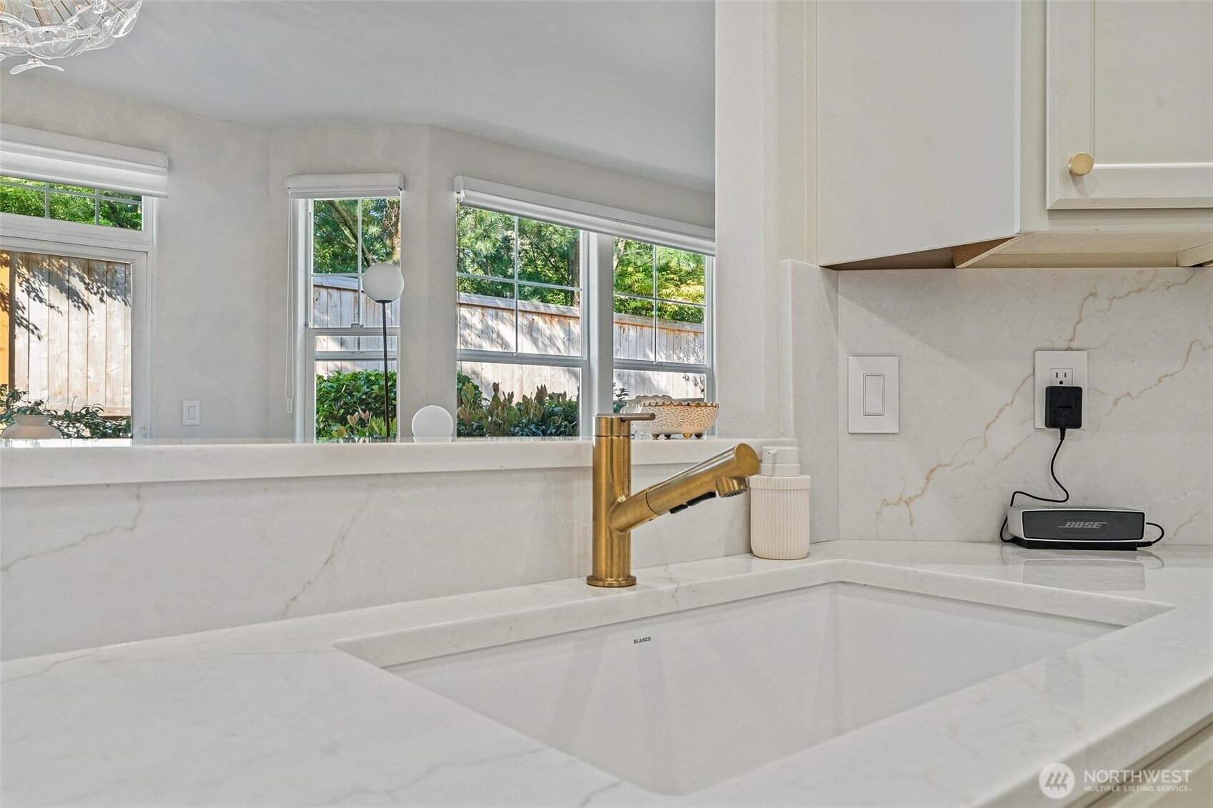 8502 Main Street, Unit E105 Edmonds, WA 98026 - Photo 15 of 39 a bathroom with a sink and a window