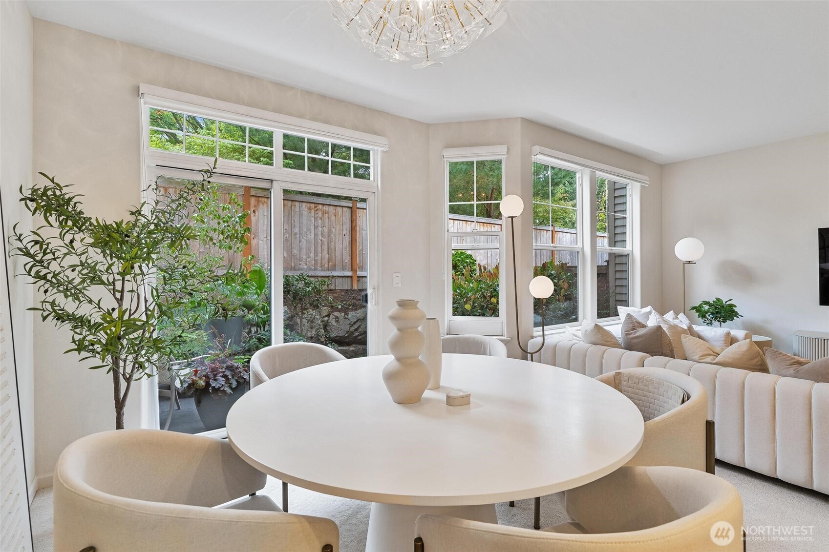 8502 Main Street, Unit E105 Edmonds, WA 98026 - Photo 17 of 39 a living room with furniture and a potted plant