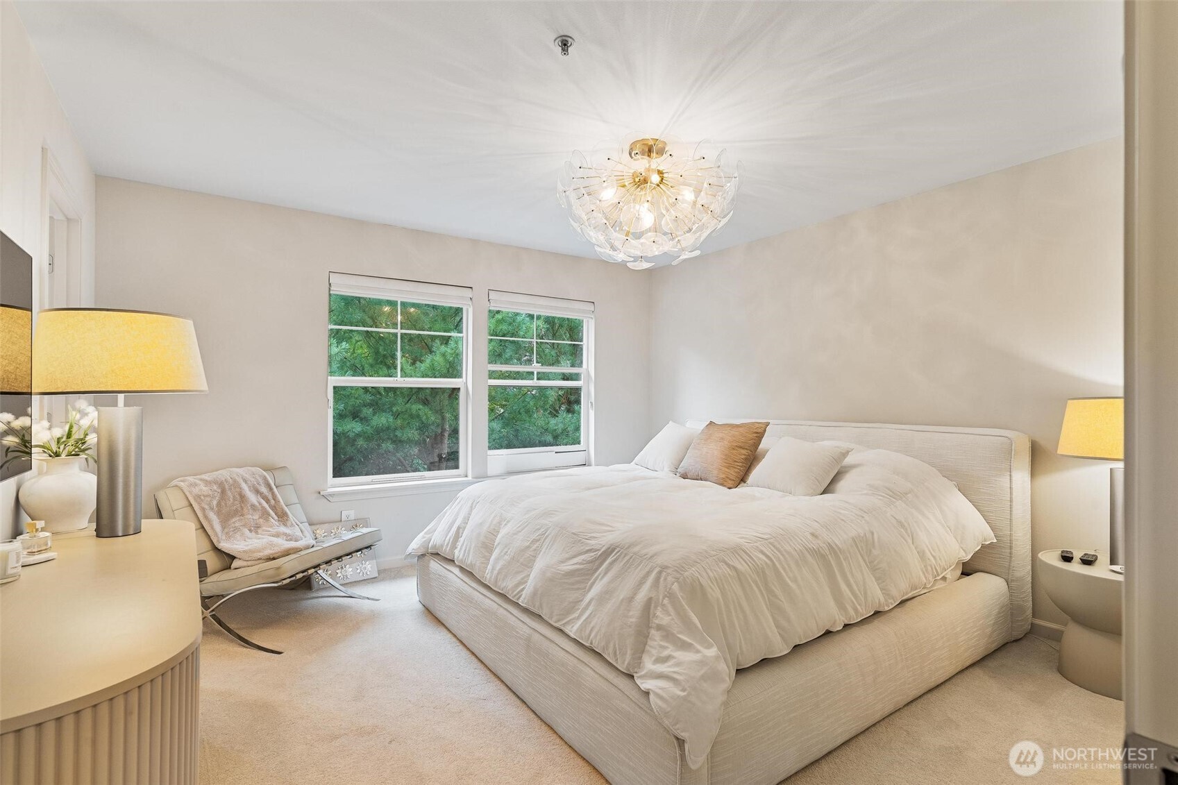 8502 Main Street, Unit E105 Edmonds, WA 98026 - Photo 22 of 39 a bedroom with a bed and a window