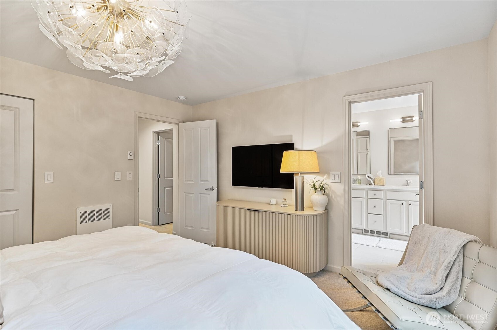 8502 Main Street, Unit E105 Edmonds, WA 98026 - Photo 23 of 39 a bedroom with a bed and a television