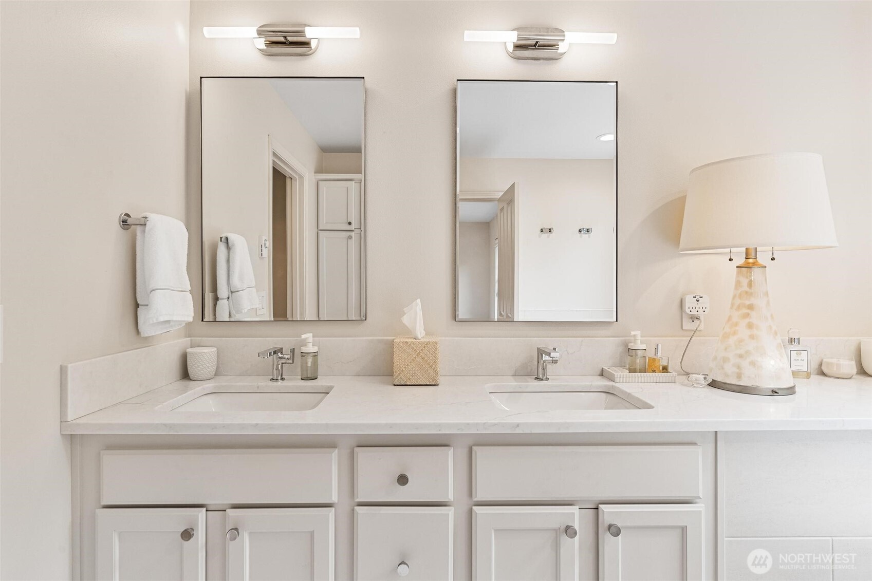 8502 Main Street, Unit E105 Edmonds, WA 98026 - Photo 25 of 39 a bathroom with double sink and a mirror