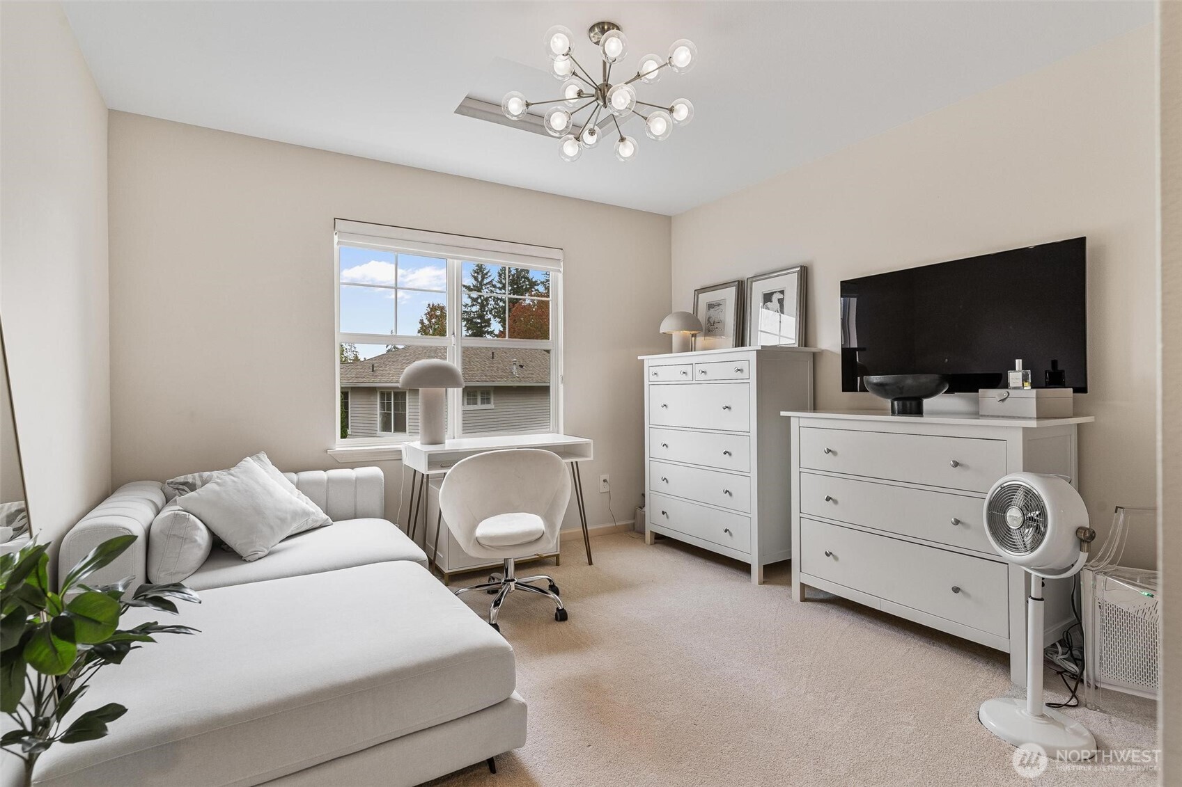 8502 Main Street, Unit E105 Edmonds, WA 98026 - Photo 28 of 39 a living room with furniture and a flat screen tv
