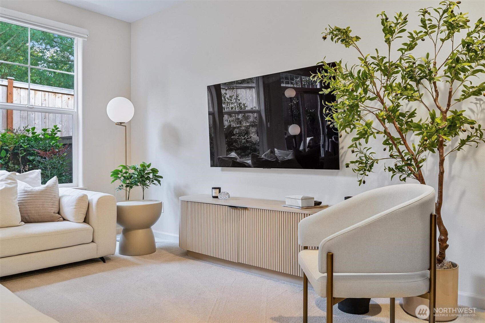 8502 Main Street, Unit E105 Edmonds, WA 98026 - Photo 5 of 39 a bathroom with a sink and mirror with bathtub