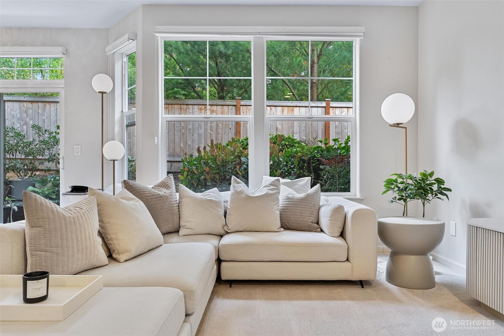 8502 Main Street, Unit E105 Edmonds, WA 98026 - Photo 6 of 39 a living room with furniture and a potted plant