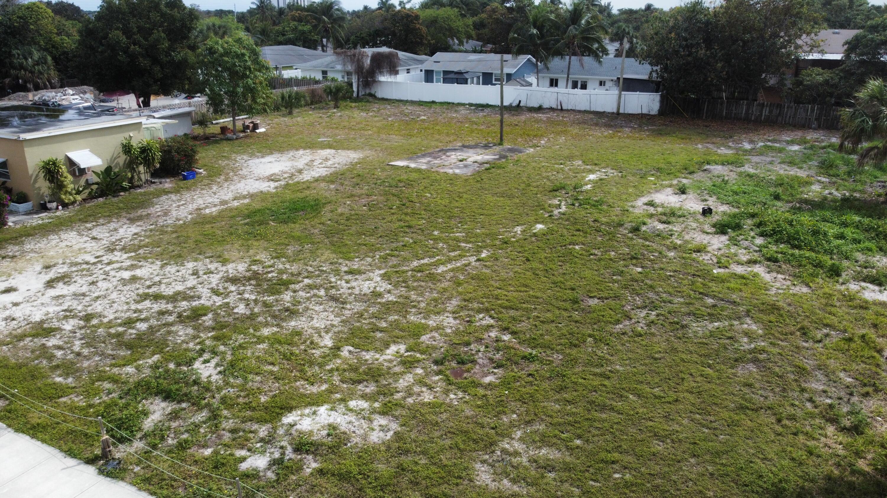 198 Southeast 4th Street Delray Beach, FL 33483 - Photo 2 of 6 a view of a swimming pool with lawn chairs and plants