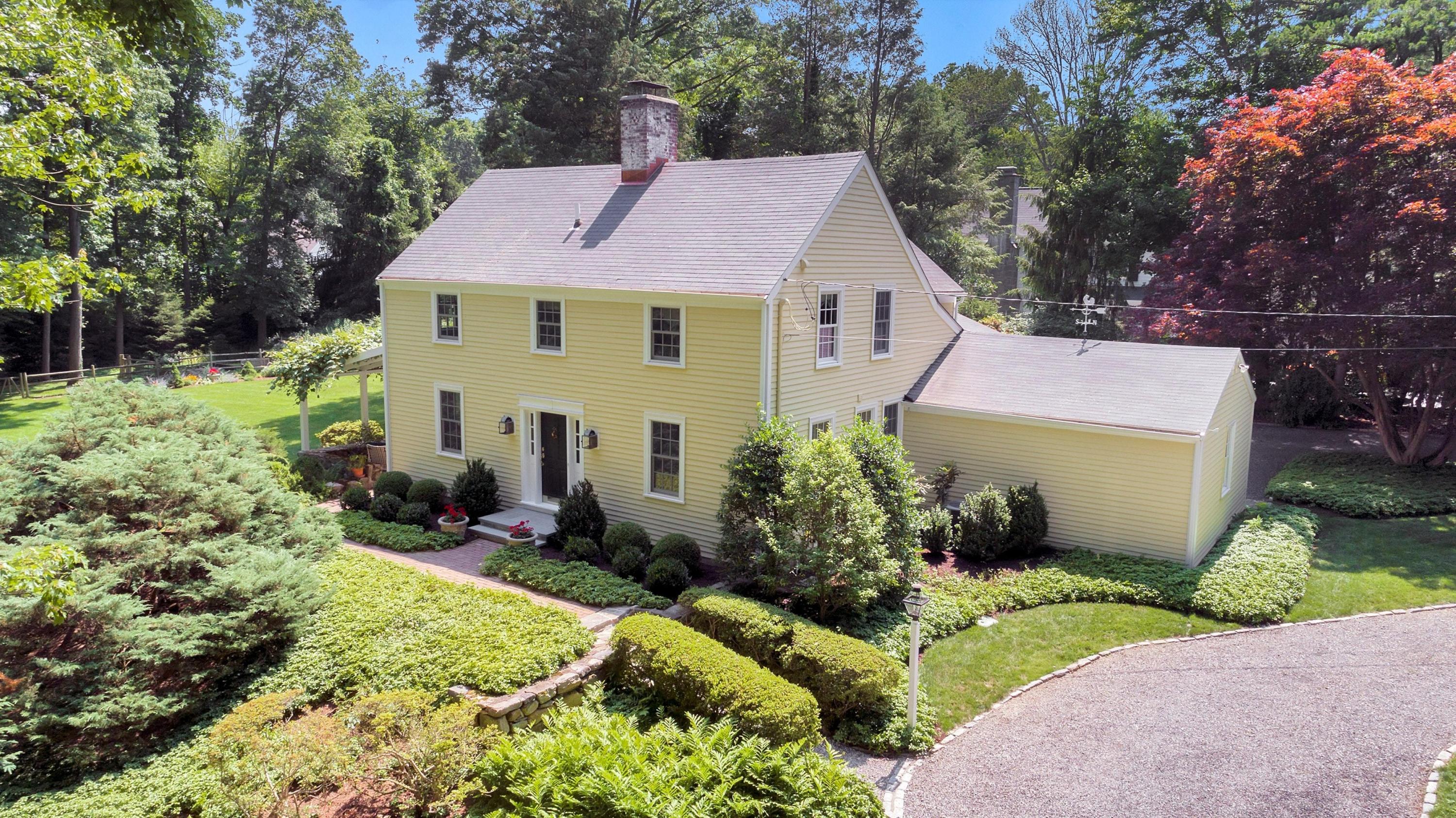 36 St Nicholas Road Darien, CT 06820 - Photo 1 of 26 a view of a house with a garden and plants