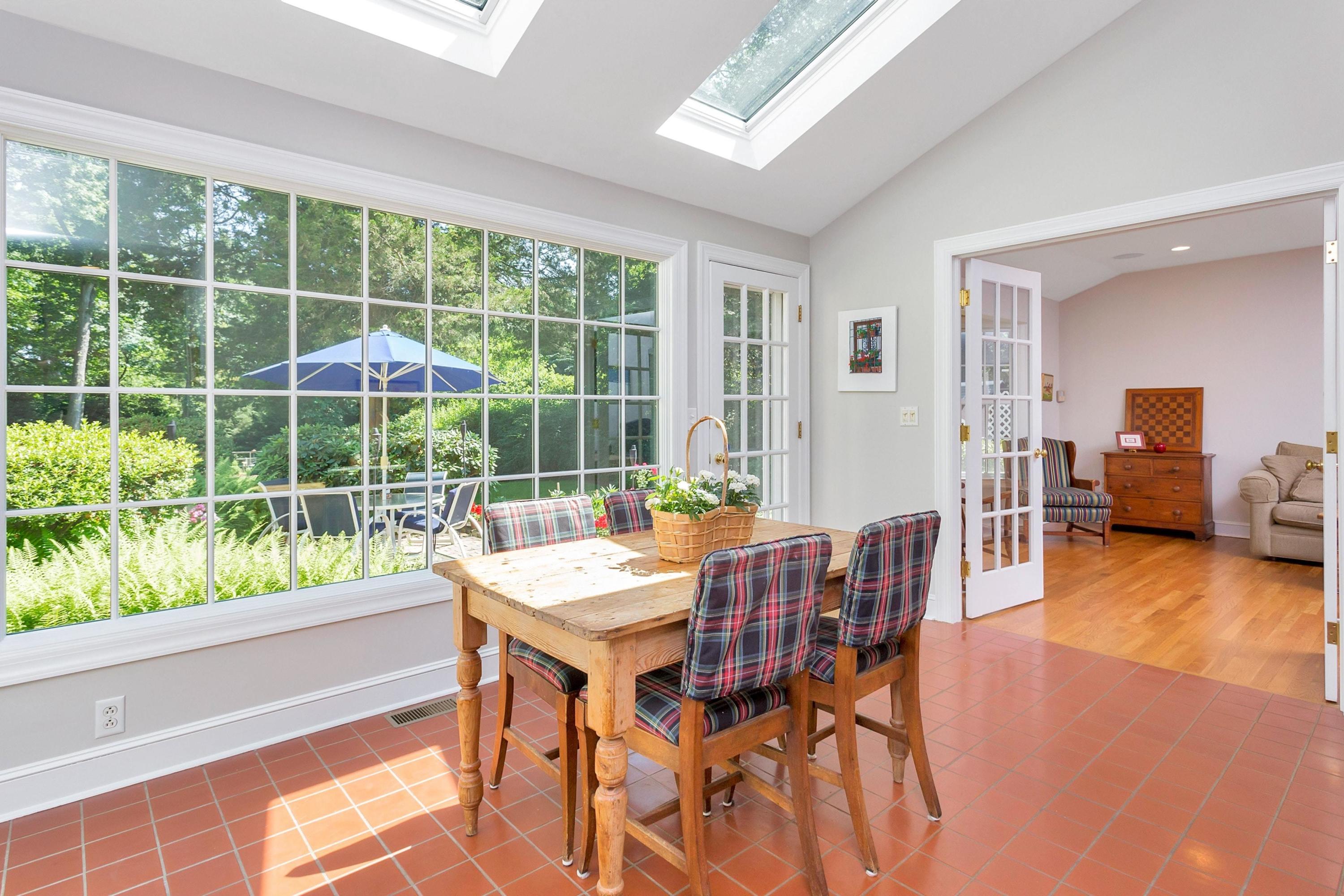 36 St Nicholas Road Darien, CT 06820 - Photo 8 of 26 a dining room with furniture window and wooden floor