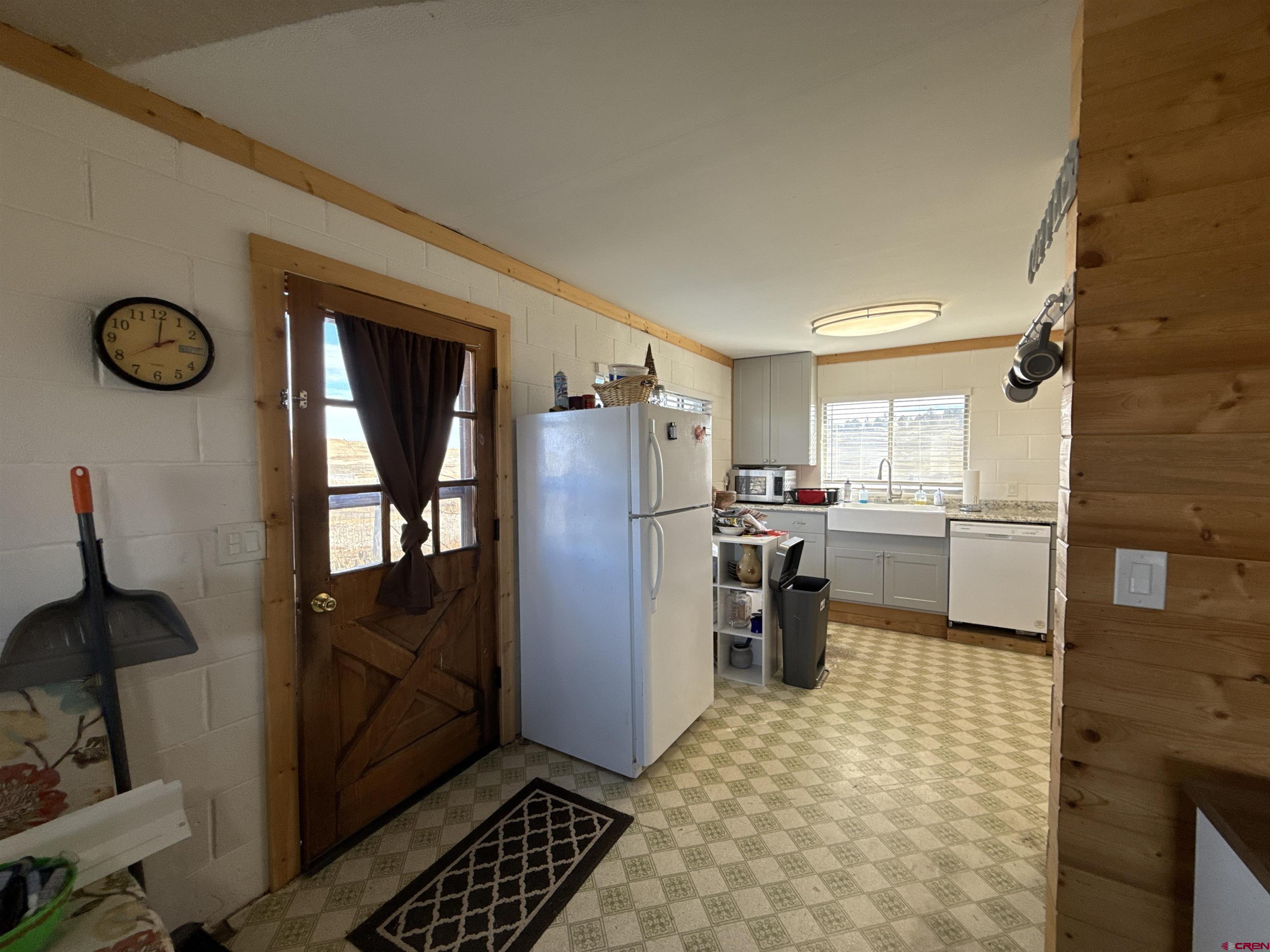 8257 Highway 172 Ignacio, CO 81137 - Photo 11 of 34 a kitchen with a refrigerator and a stove