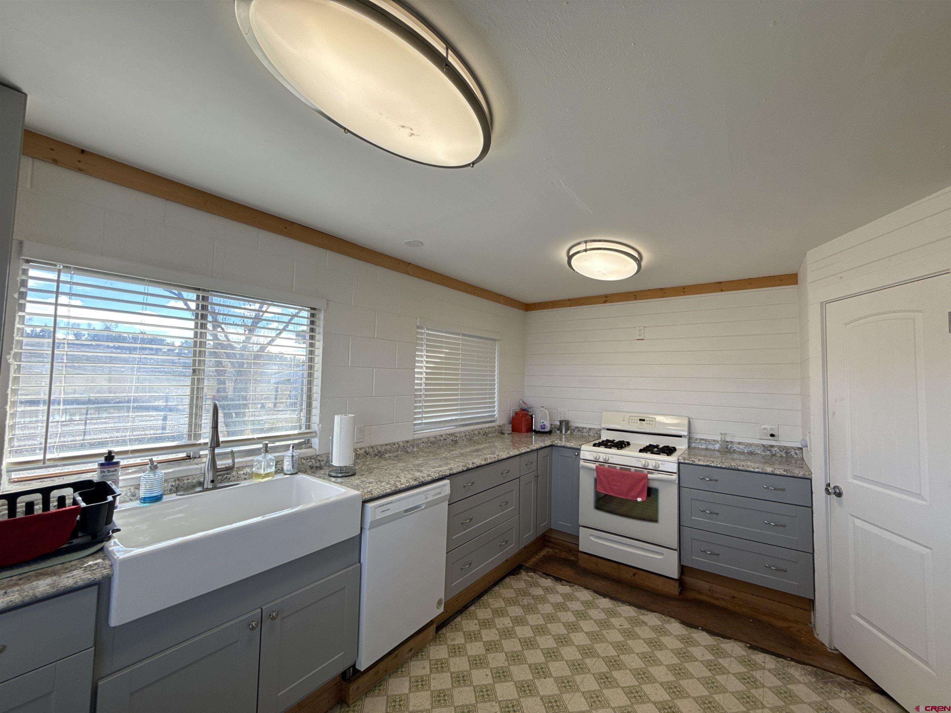 8257 Highway 172 Ignacio, CO 81137 - Photo 13 of 34 a open kitchen with a sink cabinets and window