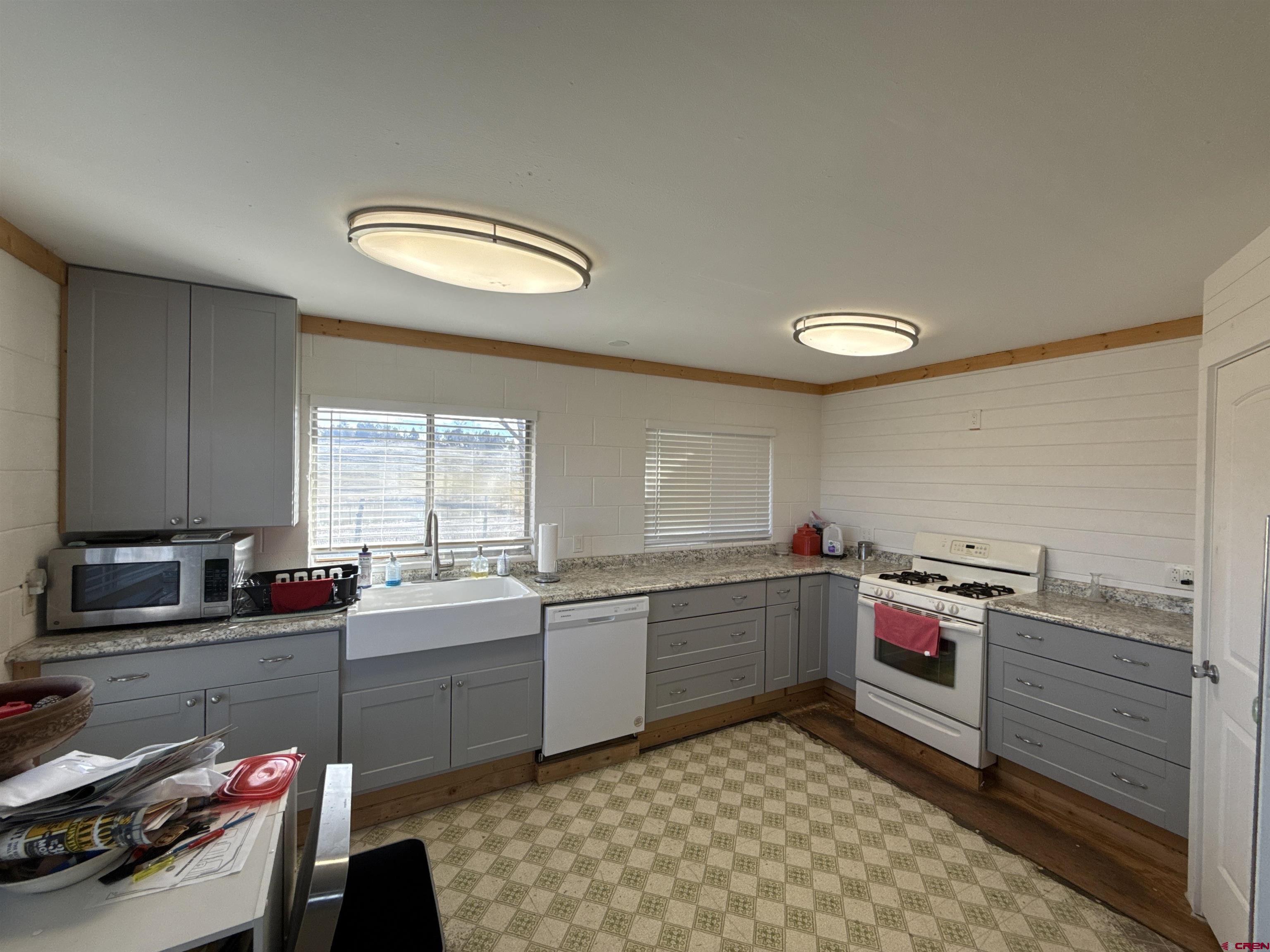 8257 Highway 172 Ignacio, CO 81137 - Photo 14 of 34 a kitchen that has a sink and cabinets