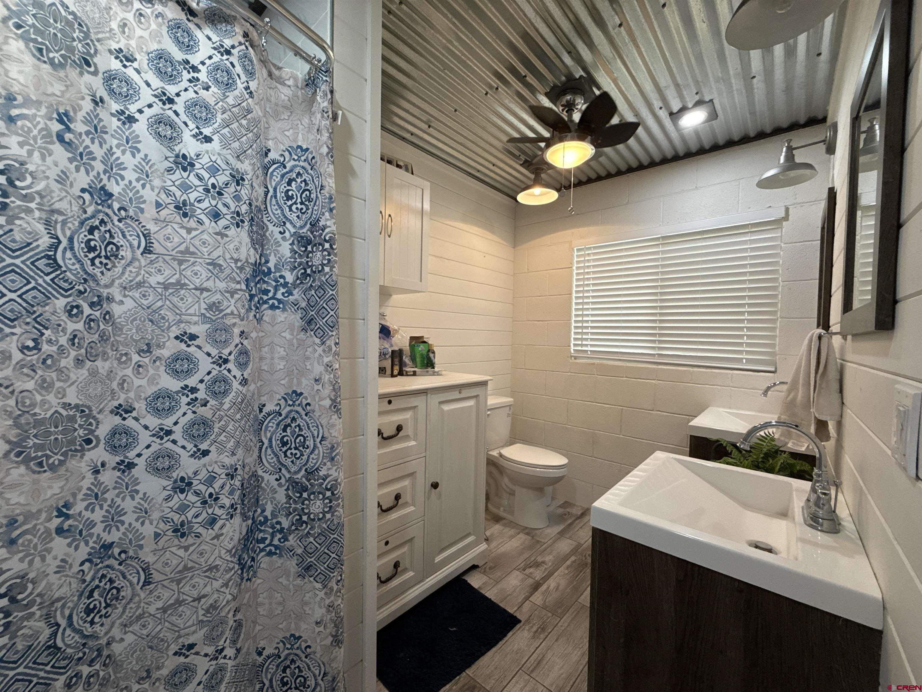 8257 Highway 172 Ignacio, CO 81137 - Photo 20 of 34 a bathroom with a toilet and a sink
