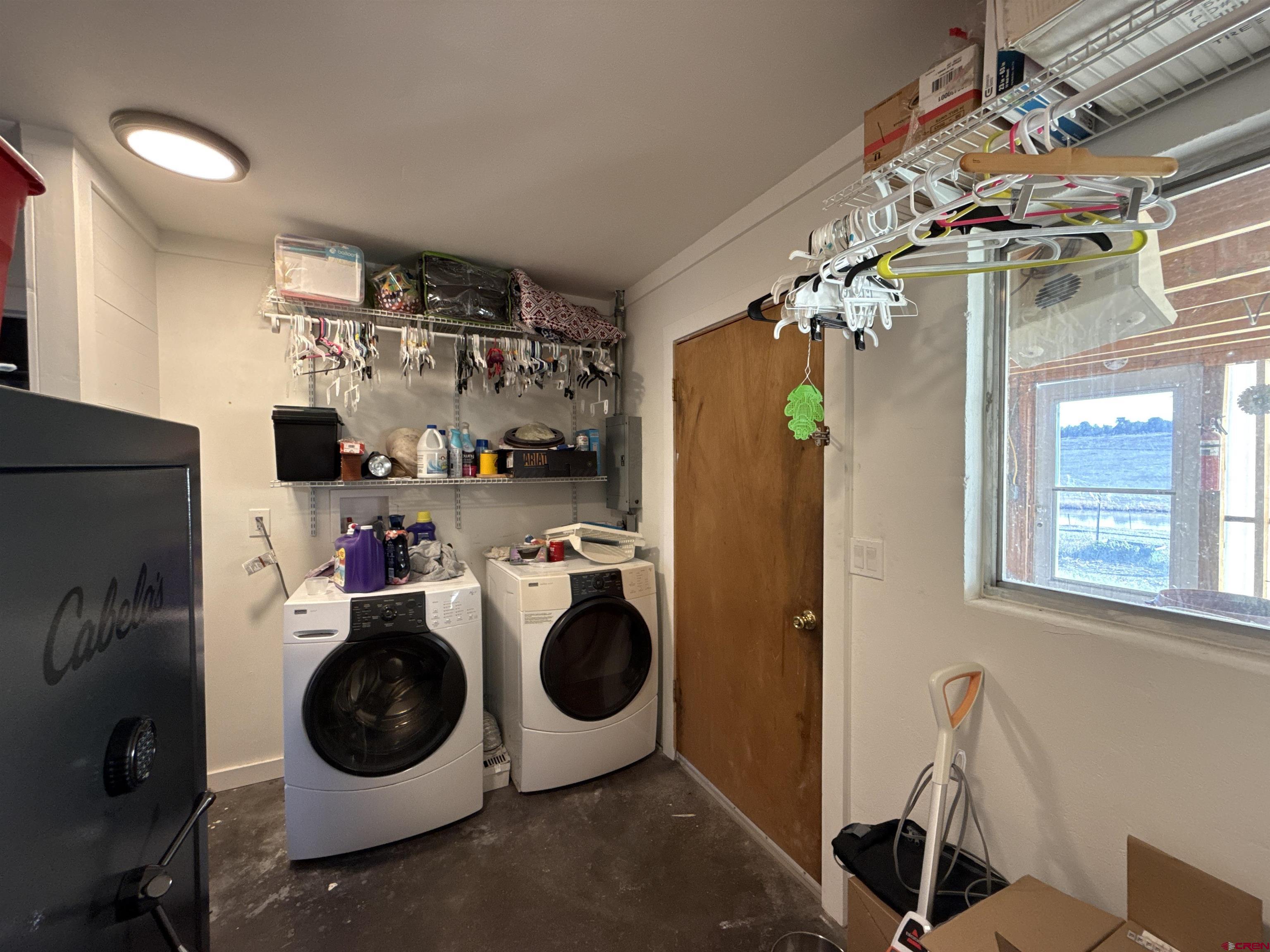 8257 Highway 172 Ignacio, CO 81137 - Photo 22 of 34 a utility room with refrigerator washer and dryer