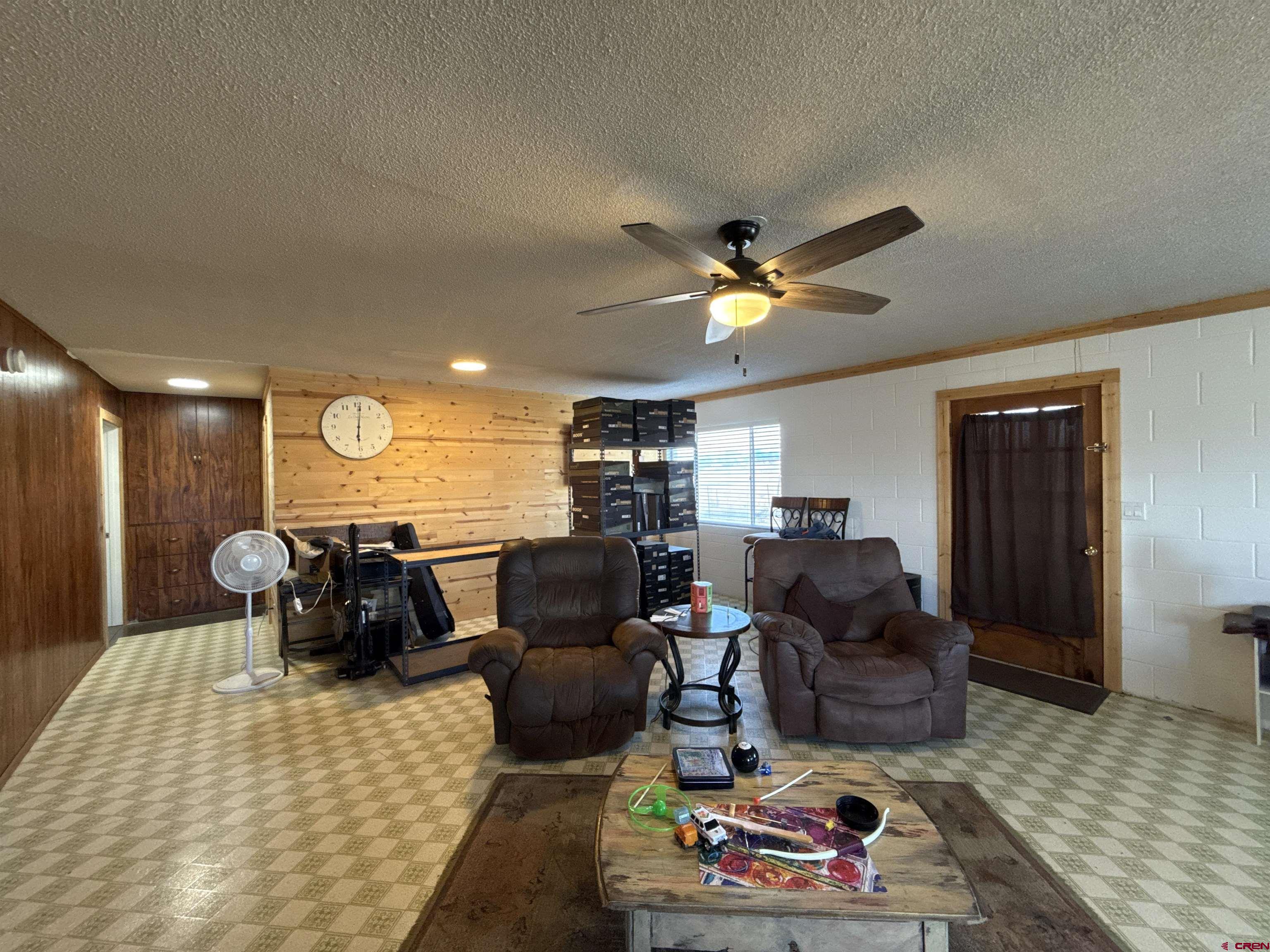8257 Highway 172 Ignacio, CO 81137 - Photo 10 of 34 a living room with furniture a rug and a flat screen tv