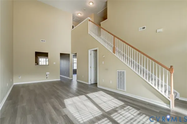 a view of an entryway with wooden floor