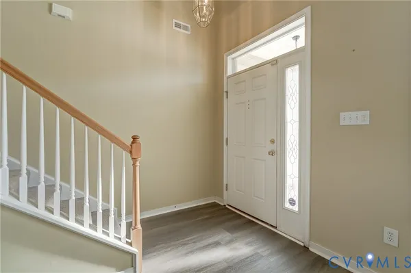 a view of staircase with rug