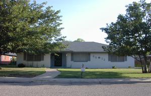 6012 Jameson Road Amarillo, TX 79106 - Photo 1 of 1 a front view of a house with a yard and a garage