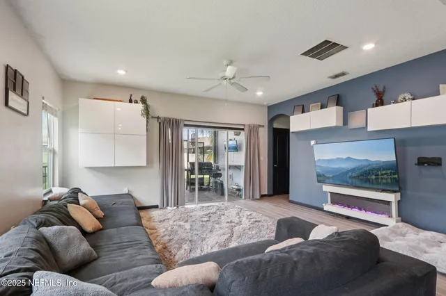 a bathroom with a sink vanity mirror and toilet