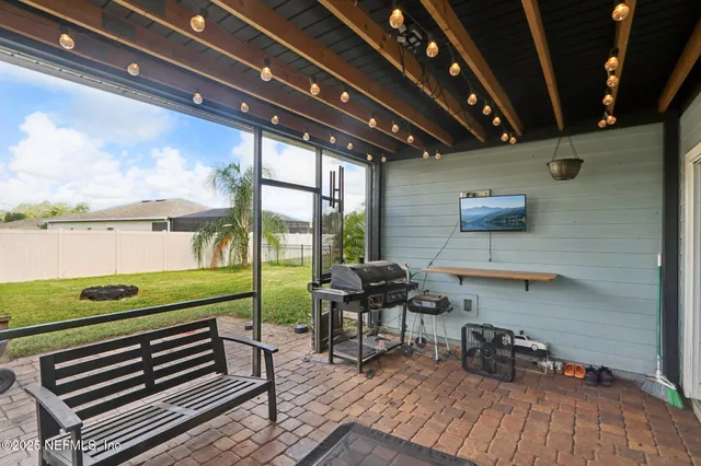 a view of a house with a yard and sitting area