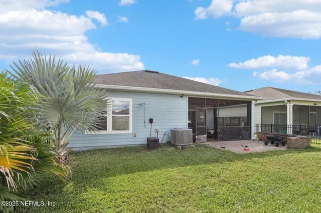 a kitchen with cabinets and chairs