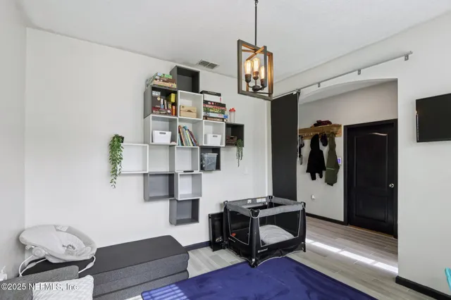 a kitchen with stainless steel appliances kitchen island granite countertop a dining table and chairs
