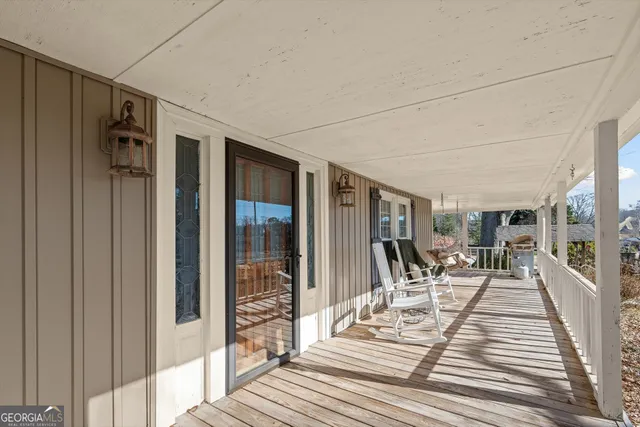 a living room with fireplace furniture and a flat screen tv